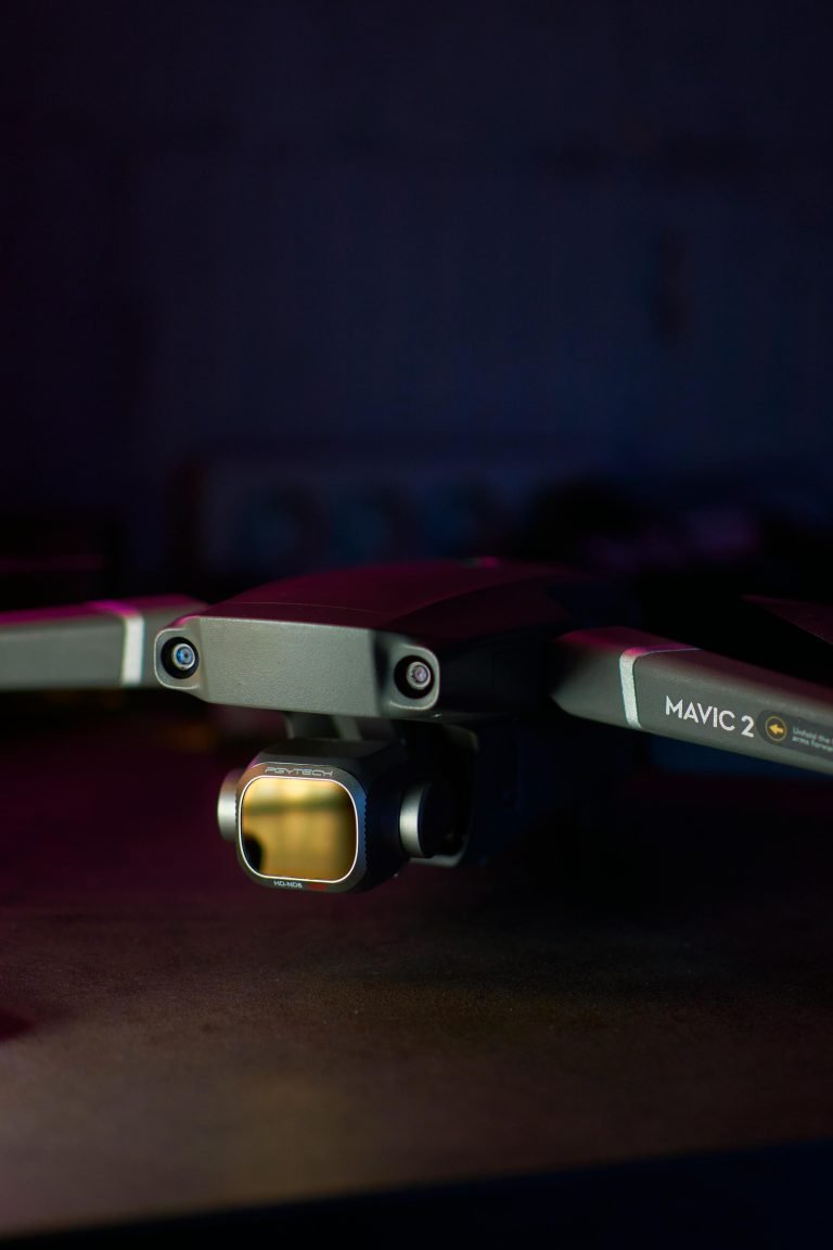 A close-up photo highlighting the Mavic 2 drone's camera and sensor on a dark background.